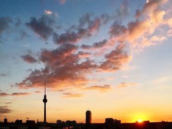 Low angle view of communications tower at sunset