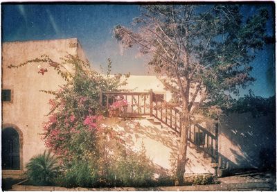 View of houses against sky on sunny day
