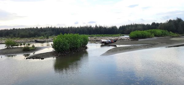 Scenic view of river against sky