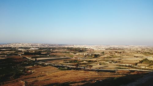 Aerial view of cityscape against clear sky