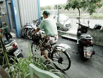 Man riding bicycle on road