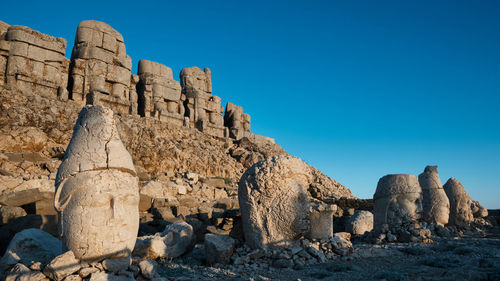Statues on eastern terrace of nemrut mount, adiyaman province, turkey. unesco world heritage site