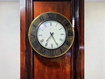 Close-up of clock on wall