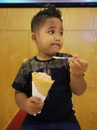 Cute boy eating food