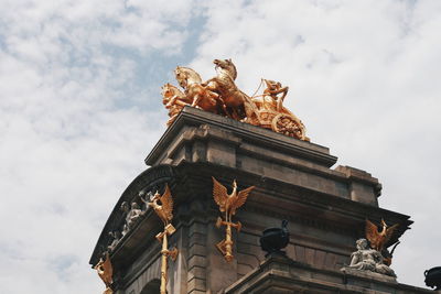 Low angle view of statue against sky