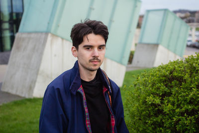 Portrait of man against plants