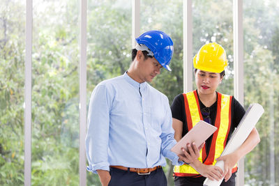 Low angle view of man working at construction site