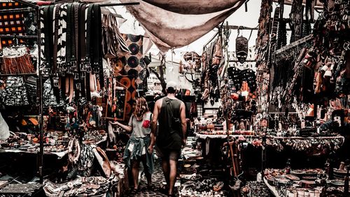 People standing at market stall