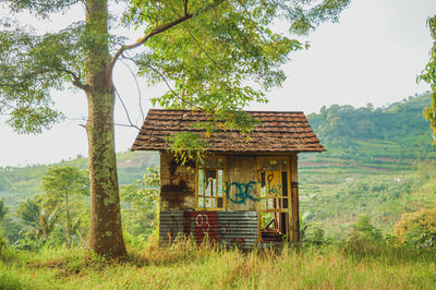 Abandoned built structure on field against clear sky