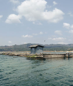 House by sea against sky