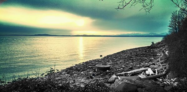 Scenic view of sea against cloudy sky