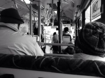 Rear view of man traveling in train