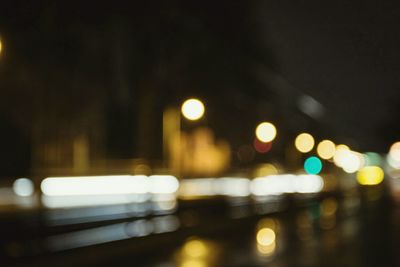 Illuminated road in city at night