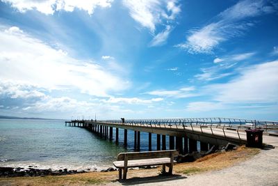 Pier over sea against sky