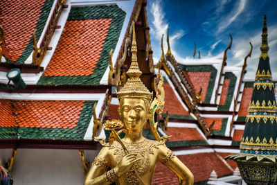 Statue of temple against building