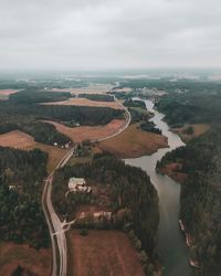 High angle view of river amidst landscape against sky