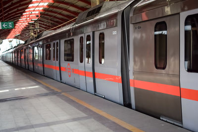 Delhi metro train arriving at jhandewalan metro station in new delhi, india,asia, public metro train