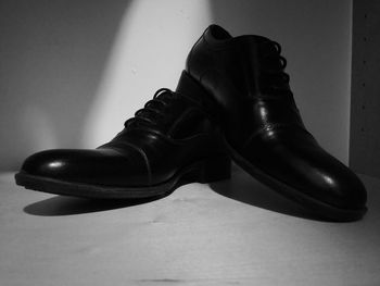 Low section of shoes on table at home