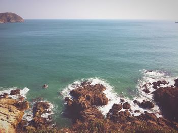 Scenic view of sea against blue sky