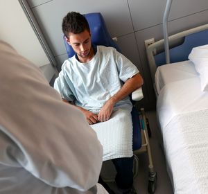 Close-up of patient and doctor in hospital