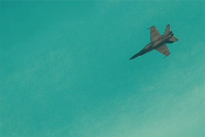 Low angle view of airplane against clear sky