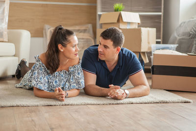 Side view of family sitting on table