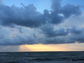 Scenic view of sea against dramatic sky