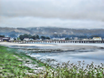 Scenic view of sea against cloudy sky