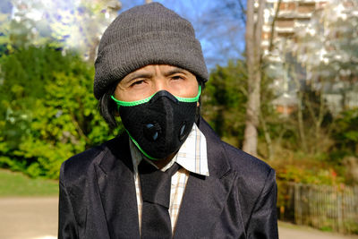 Portrait of man covering face