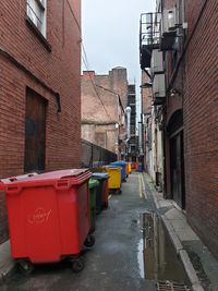 Narrow street amidst buildings in city