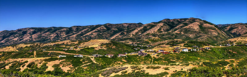 High angle view of mountain range against blue sky