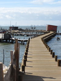 Pier over sea against sky