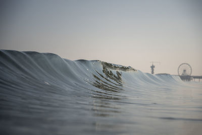 Close-up of water splashing against clear sky