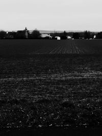 Scenic view of farm against sky