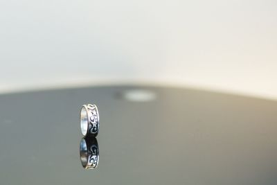 Close-up of wedding rings on water