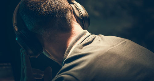 Close-up of man wearing headphones