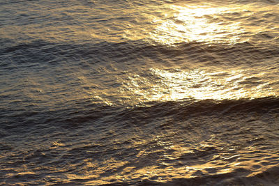 Full frame shot of rippled water at sunset