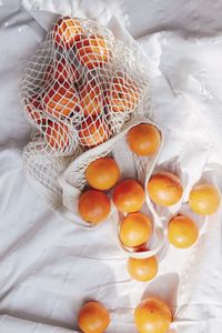 High angle view of fruits in basket on table