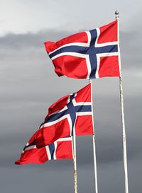 Low angle view of flag against sky