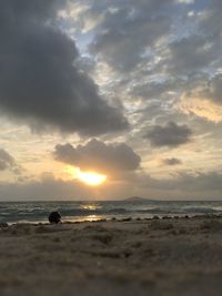 Scenic view of beach against sky during sunset