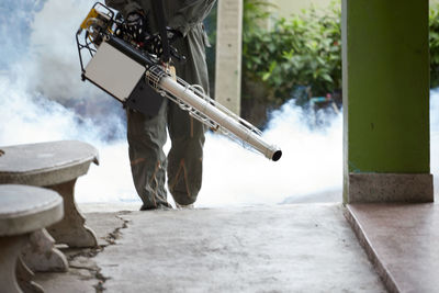 A worker use fumigation mosquitoes machine for kill mosquito