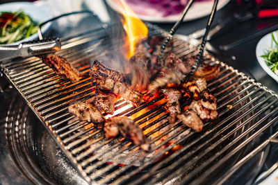 Close-up of meat on barbecue grill