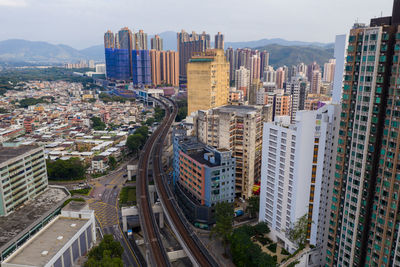 High angle view of street amidst buildings in city