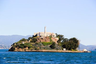 View of lighthouse against clear blue sky