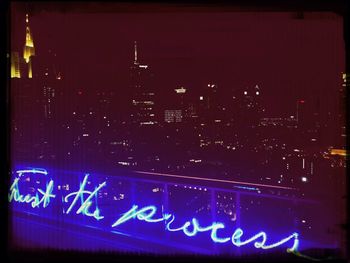 Illuminated information sign at night