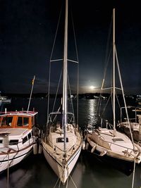 Boats moored at harbor