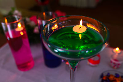 Close-up of wine glasses on table