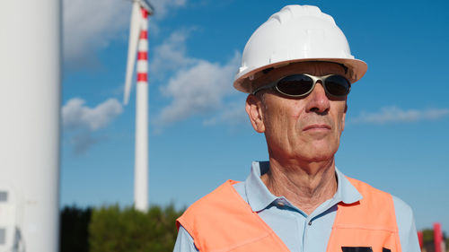 Portrait of man wearing sunglasses against sky