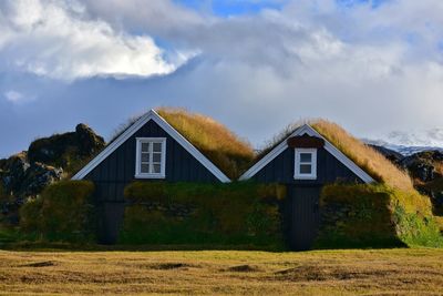House on field against sky