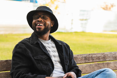 Portrait of young man sitting outdoors